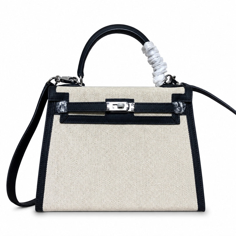 Top Selling Kelly 25 Bag With Outside Stitching, Made Of Textured Canvas & Soft Swift Leather Patchwork, Classic Black Silver Hardware Combination, Stunning Mixed Material Texture Dimensions: Length 25 * Width 10 * Height 18cm
