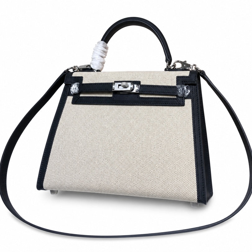 Top Selling Kelly 25 Bag With Outside Stitching, Made Of Textured Canvas & Soft Swift Leather Patchwork, Classic Black Silver Hardware Combination, Stunning Mixed Material Texture Dimensions: Length 25 * Width 10 * Height 18cm