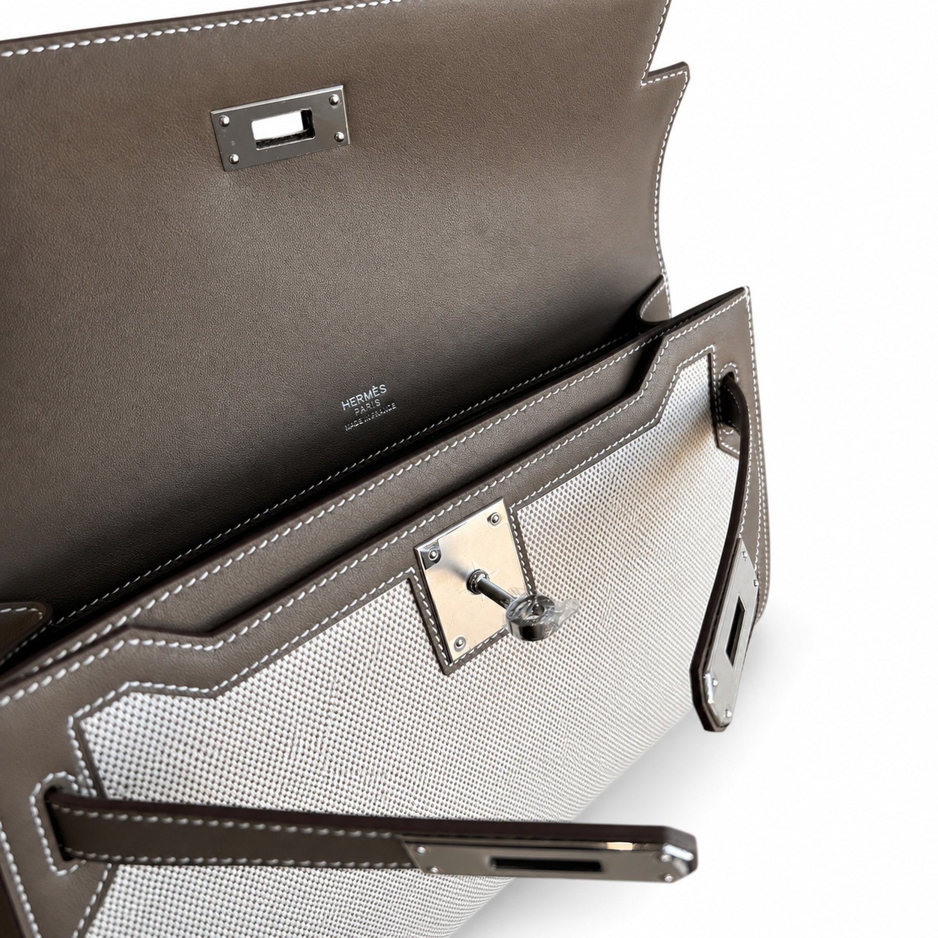 Kelly Depeches 25 clutch, canvas and swift leather (with additional shoulder strap), can be carried cross-body, can be carried by hand or on the wrist, daily needs, seamless switching between business