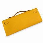 Kelly cut clutch, evening bag, epsom leather, wax thread hand-sewing, amber yellow, gold buckle