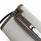 Kelly Depeches 25 clutch, canvas and swift leather (with additional shoulder strap), can be carried cross-body, can be carried by hand or on the wrist, daily needs, seamless switching between business