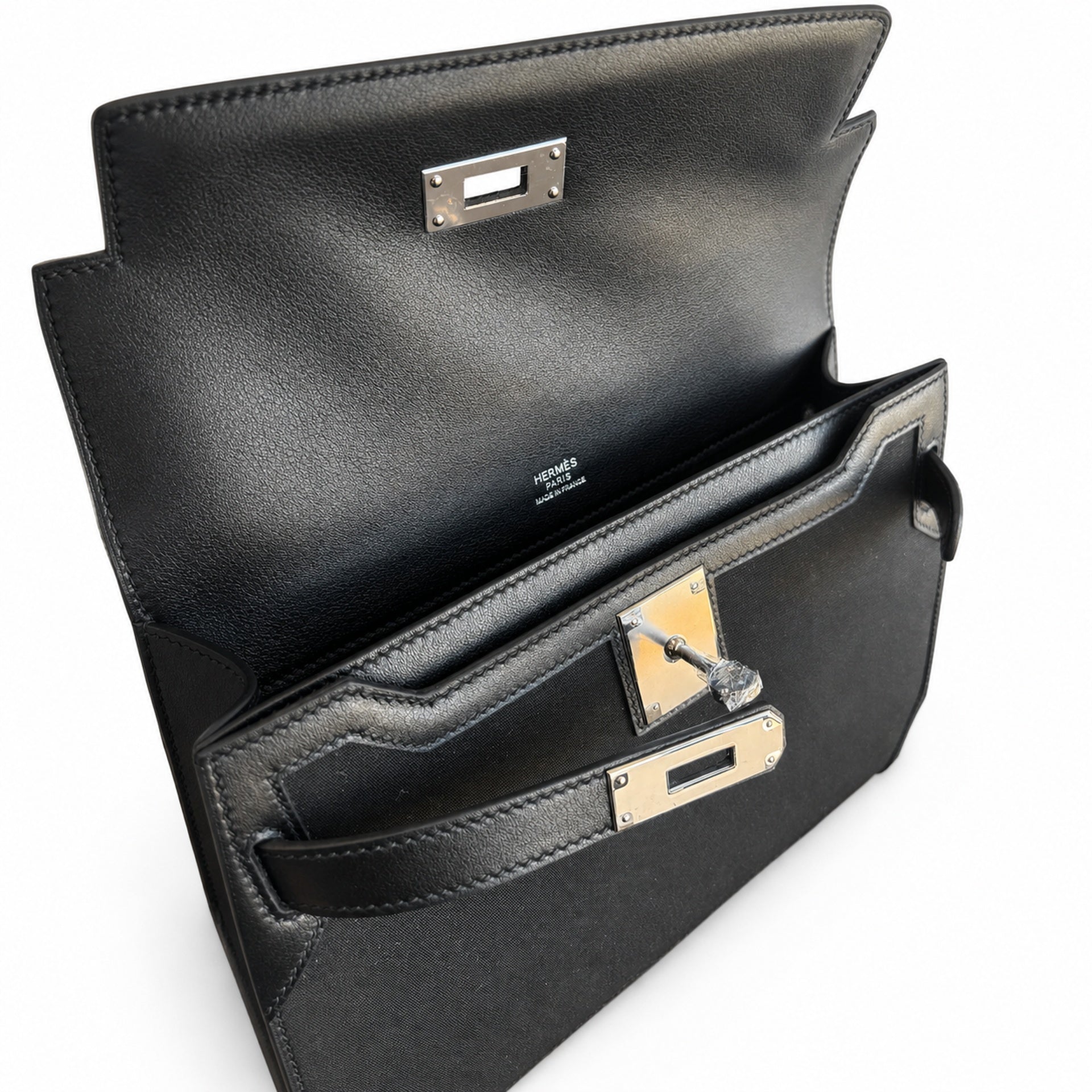 Kelly Depeches 25 clutch, canvas and swift leather (with additional shoulder strap), can be carried cross-body, can be carried by hand or on the wrist, daily needs, seamless switching between business
