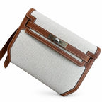Kelly Depeches 25 clutch, canvas and swift leather (with additional shoulder strap), can be carried cross-body, can be carried by hand or on the wrist, daily needs, seamless switching between business