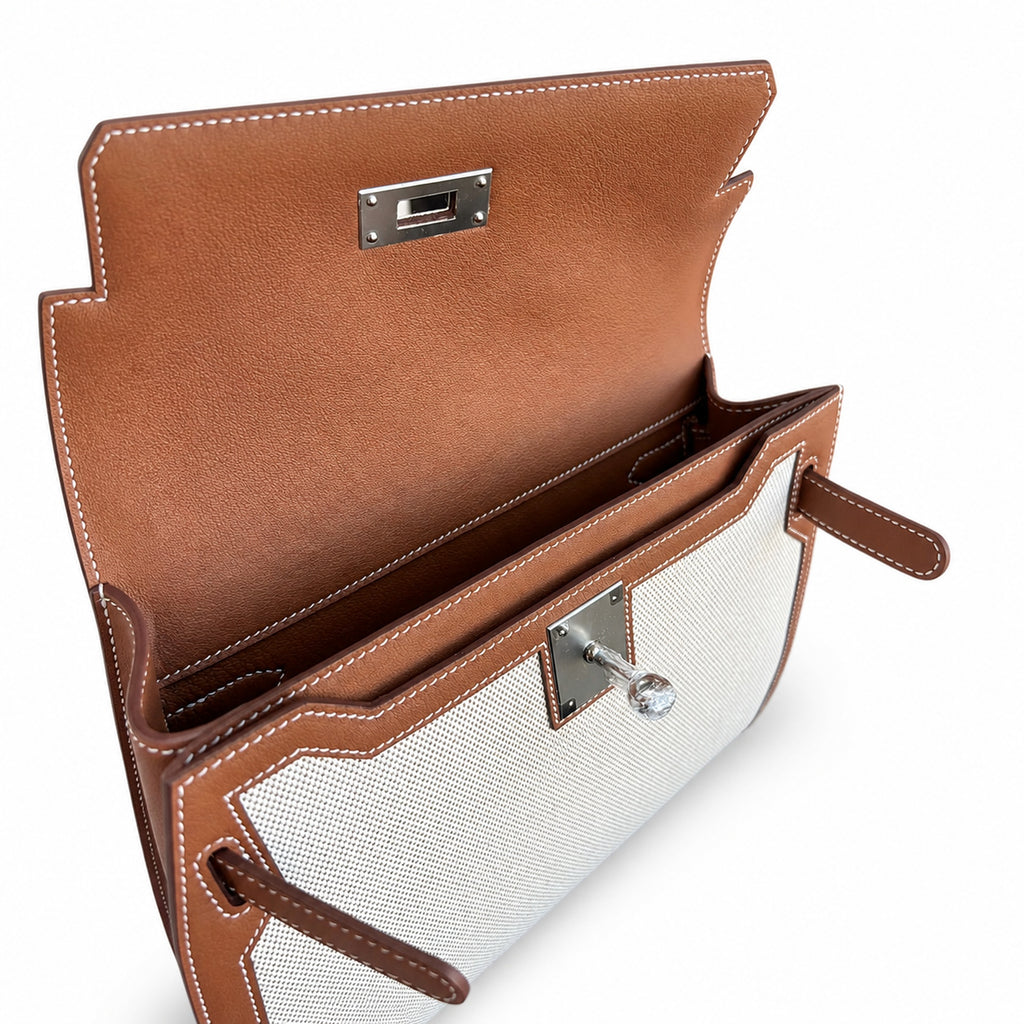 Kelly Depeches 25 clutch, canvas and swift leather (with additional shoulder strap), can be carried cross-body, can be carried by hand or on the wrist, daily needs, seamless switching between business